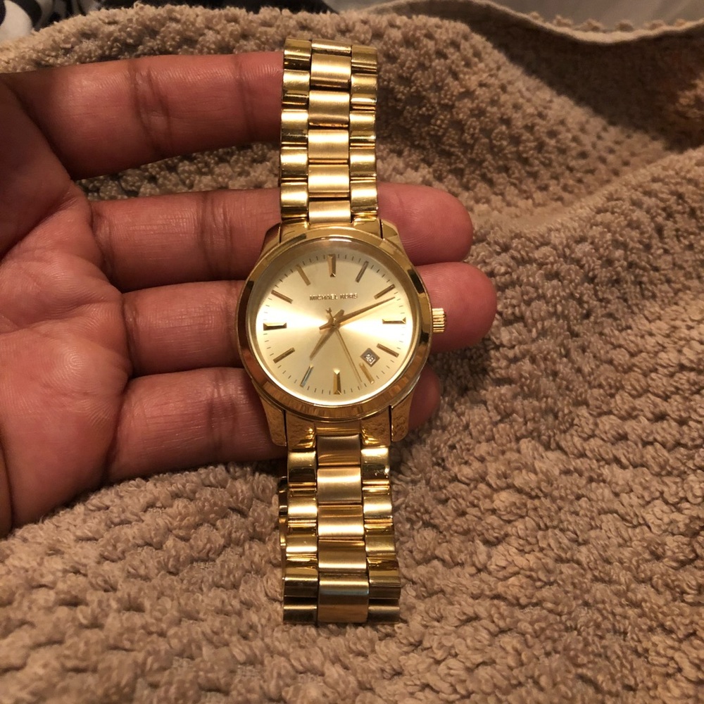 Men’s Michael Kors Gold Tone watch.